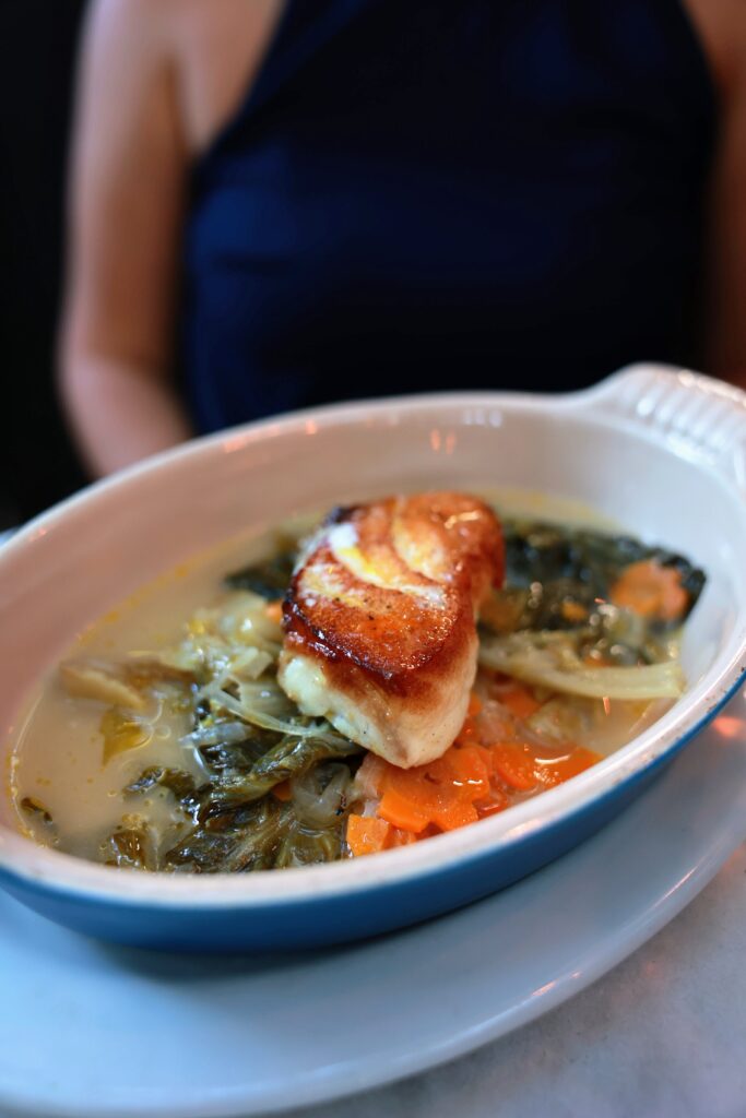 a photo of a fish from Chez Nous, one of the top places to eat in Charleston, SC