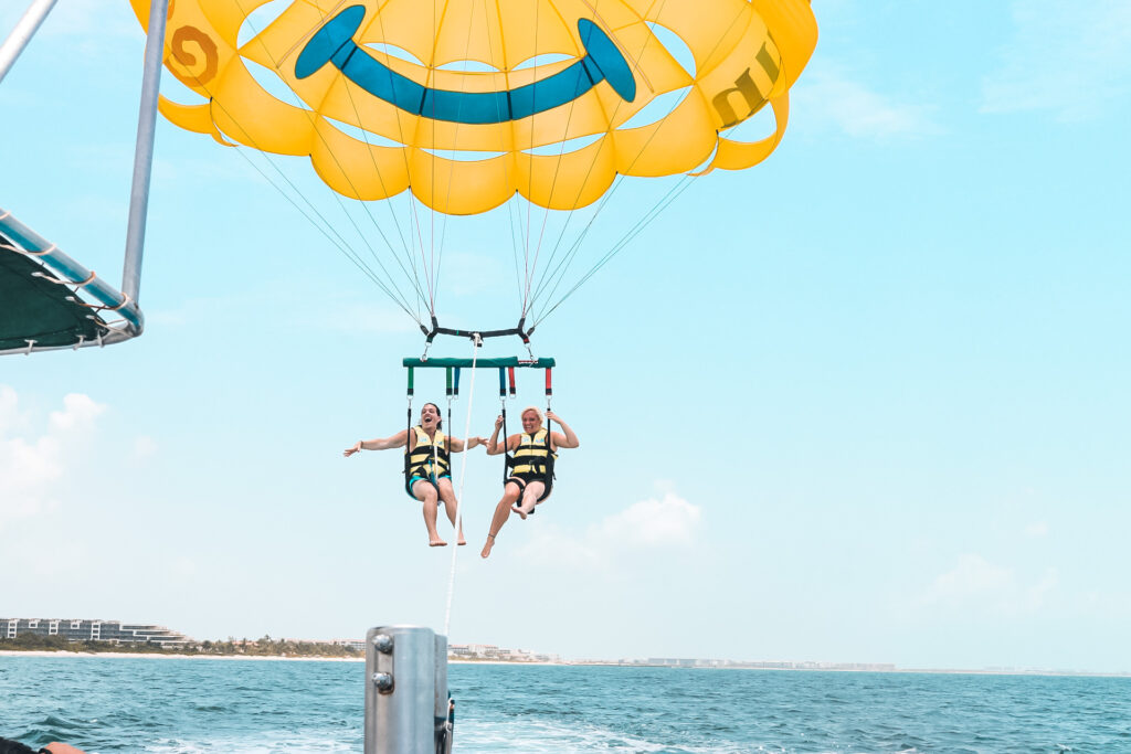 picture of us parasailing at Playa Mujeres for the blog Are Excellence Collection Hotels the best?