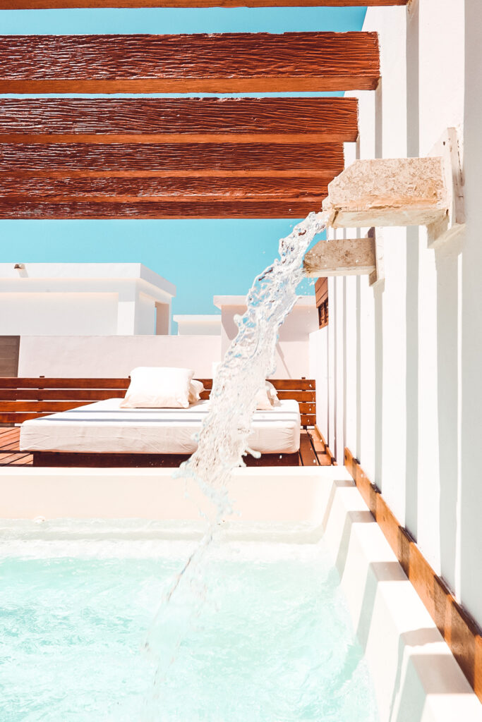 shot of water falling into a rooftop pool ontop of a Excellence Club Suite for the blog Are Excellence Collection Hotels the best?