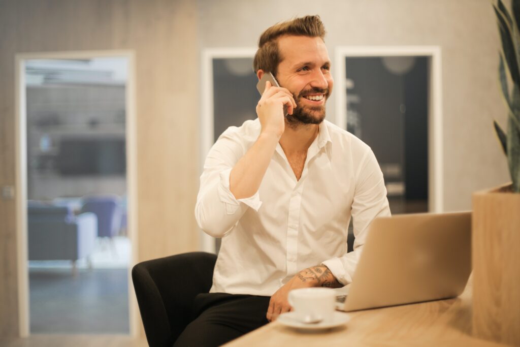 a photo of a man on a phone, used in the blog on building a successful morning routine