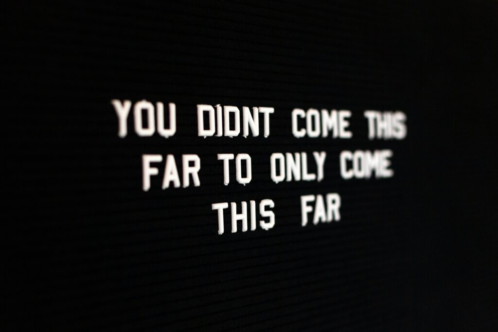 a photo of a motivational sign that reads, "you didn't come this far to only come this far", used in the blog on building a successful morning routine